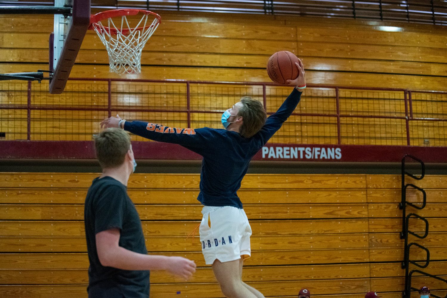 W.F. West senior Carter McCoy rises to throw down a dunk during practice on Tuesday.