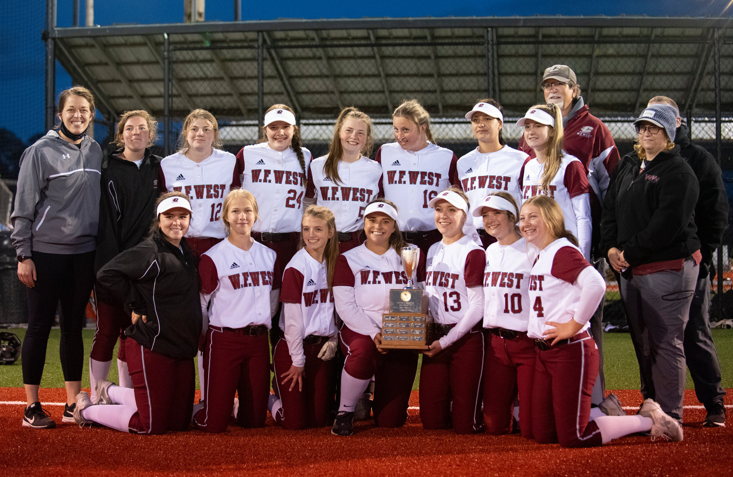 W.F. West softball holds the district championship trophy after defeating league rival Rochester in the title game on Thursday in Chehalis.