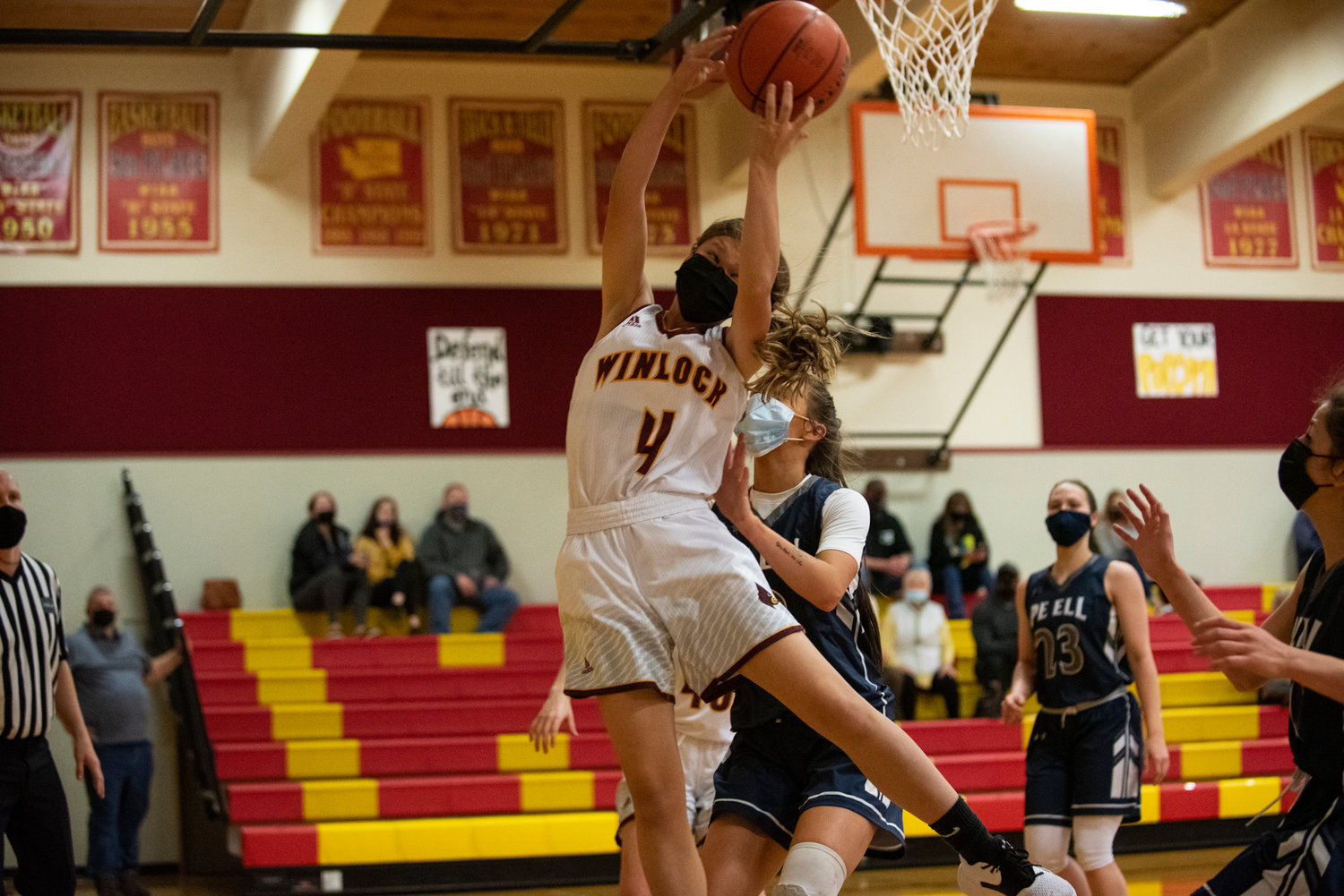 Winlock's Kindyl Kelly pulls down an offensive rebound against Pe Ell on Saturday.