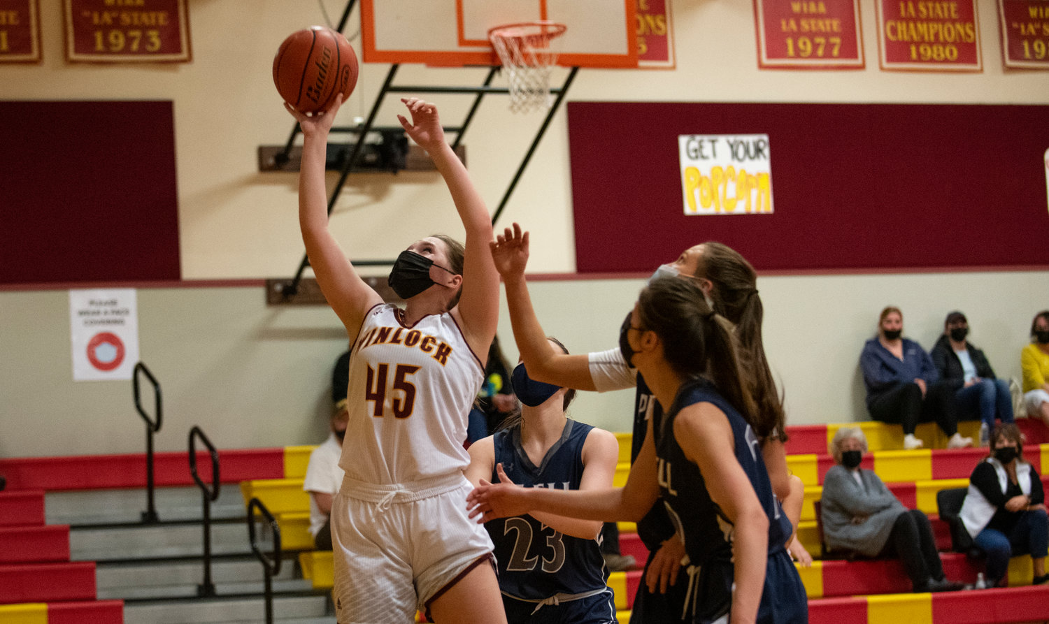 Winlock's Madison Vigre (45) takes it up for two points against Pe Ell.
