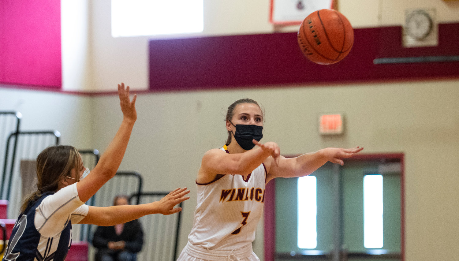 Winlock point guard Karlie Jones (3) dishes off a pass against Pe Ell.
