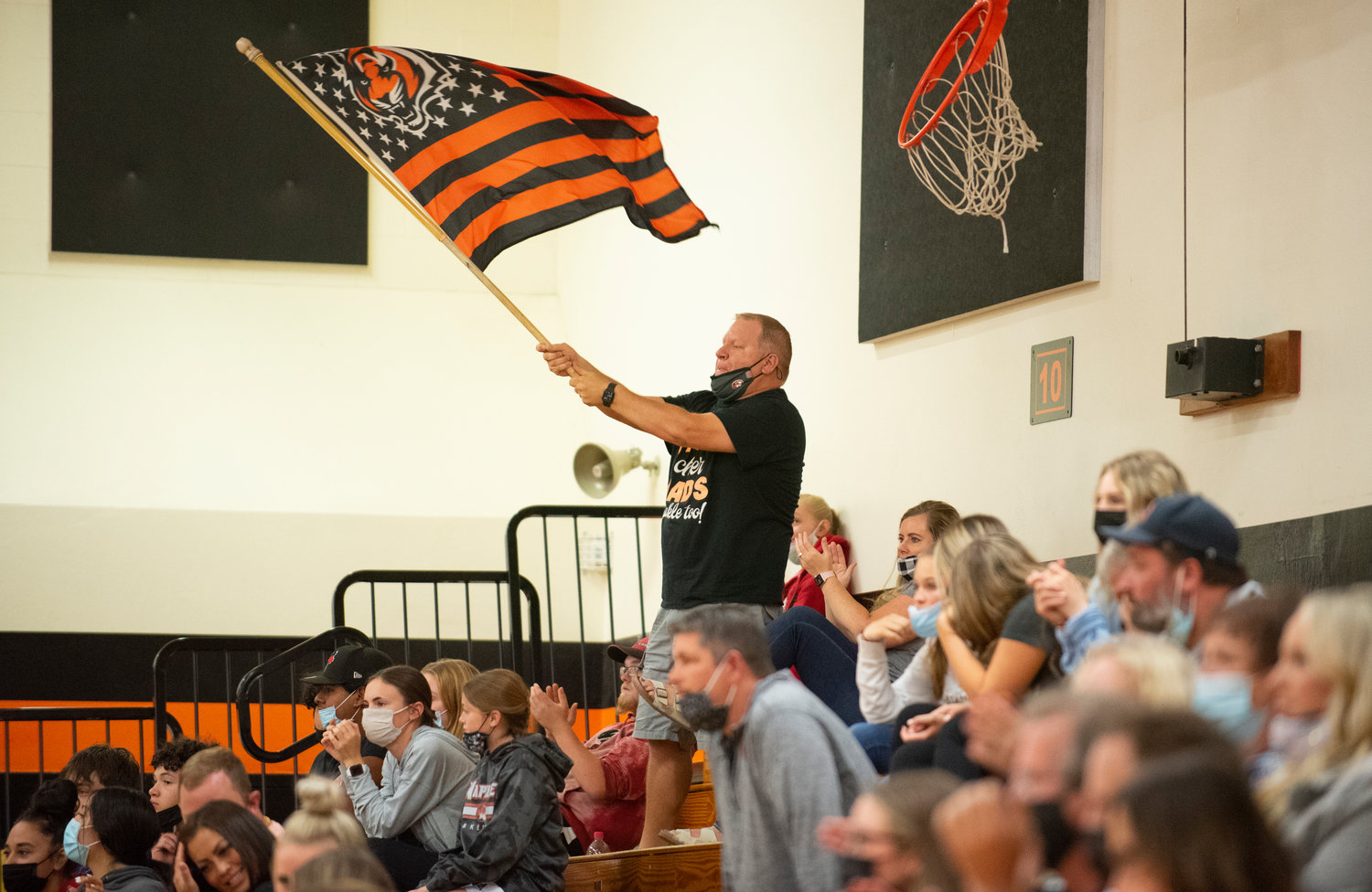 A Napavine fan waves a Tigers flag during a game against Rainier on Tuesday.