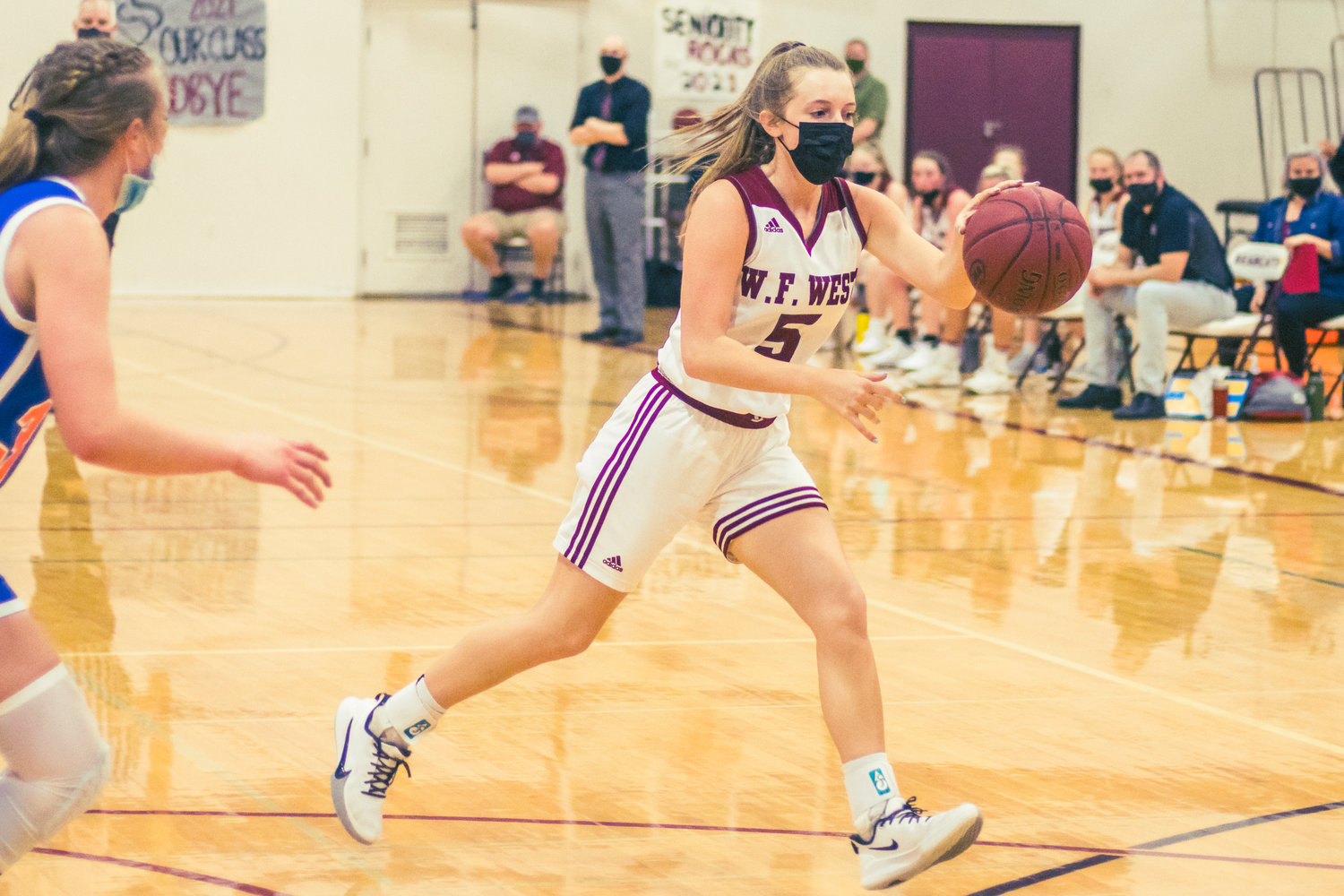 W.F. West's Makayla Mencke (5) dribbles down the court during a game against Ridgefield in Chehalis Wednesday night.
