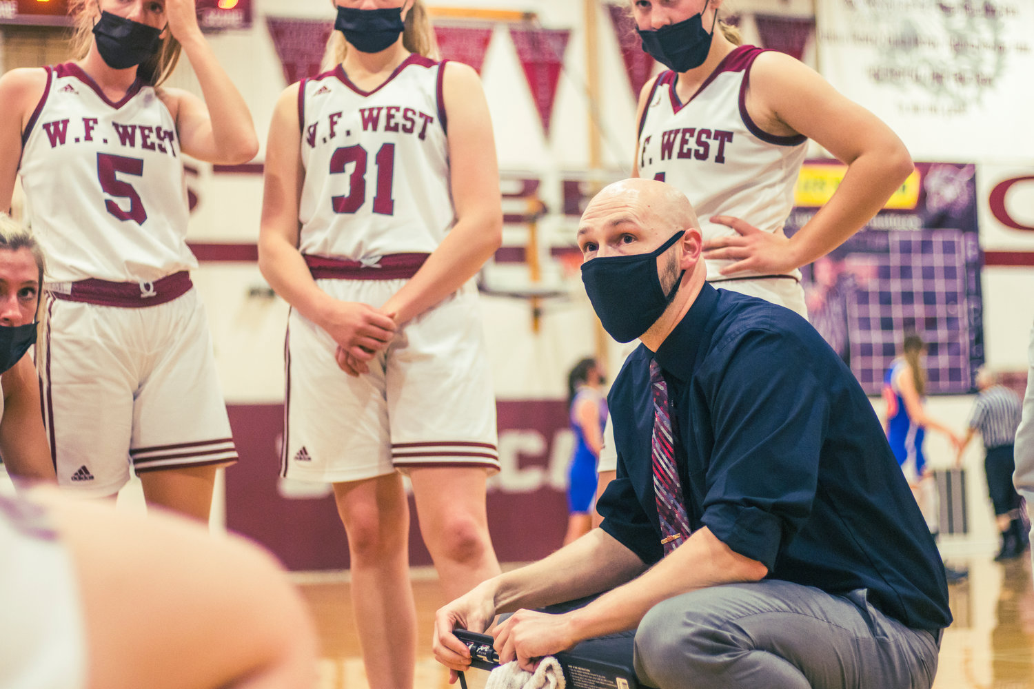 W.F. West's coach Kyle Karnofski talks to players during a game against Ridgefield in Chehalis Wednesday night.