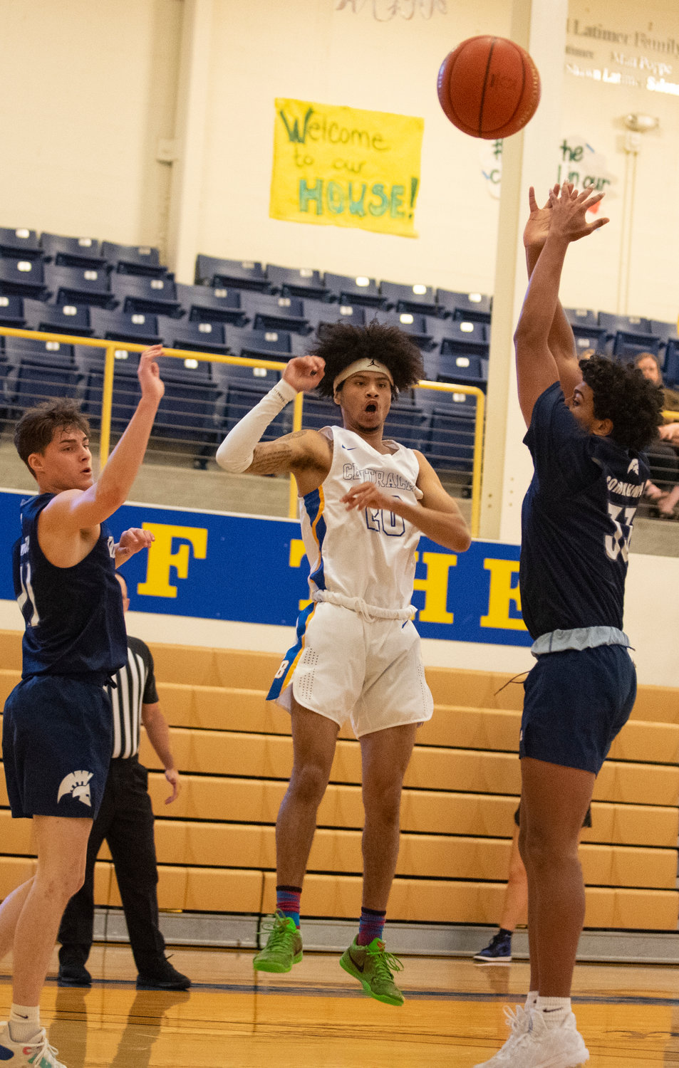 Centralia College's Jameel Morton (20) tosses a pass into the paint against Tacoma.
