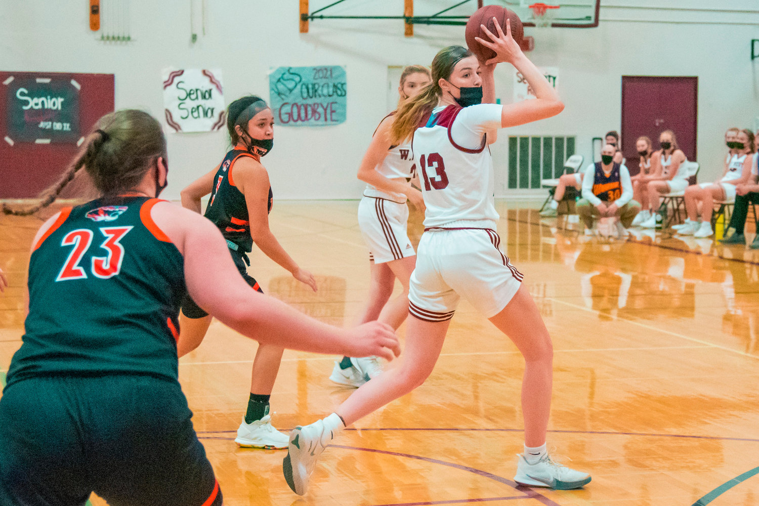 W.F. West’s Drea Brumfield (13) keeps the ball away from defenders during a game against the Tigers played Monday night in Chehalis.