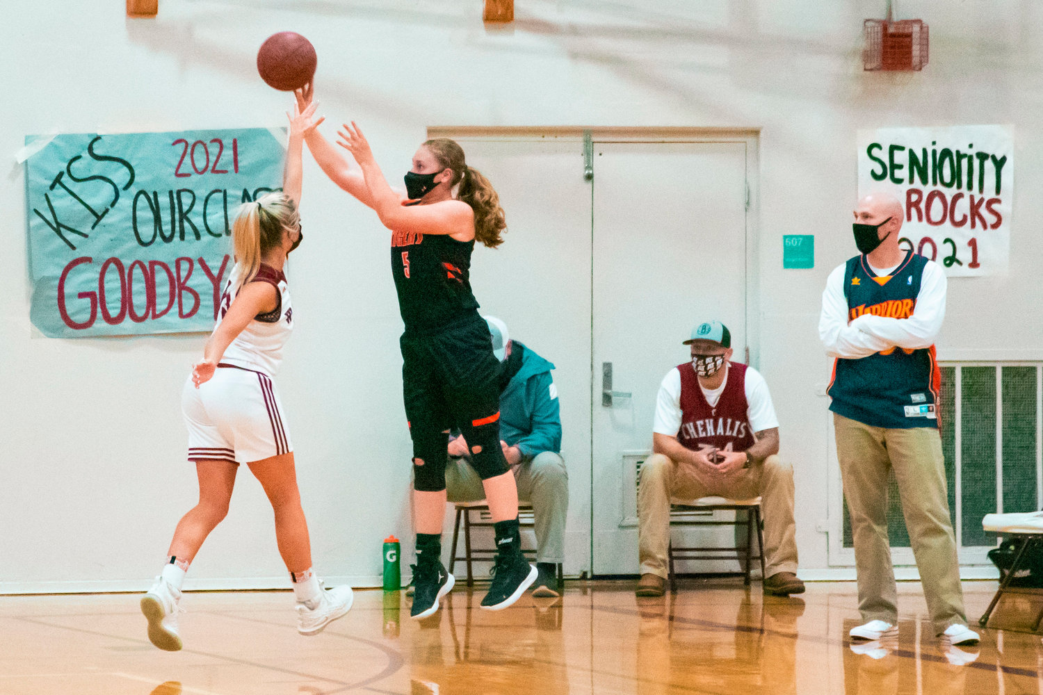 W.F. West’s Madi Mencke (15) attempts to block a shot by Centralia’s Emily Wilkerson (5) during a game against the Tigers played Monday night in Chehalis.
