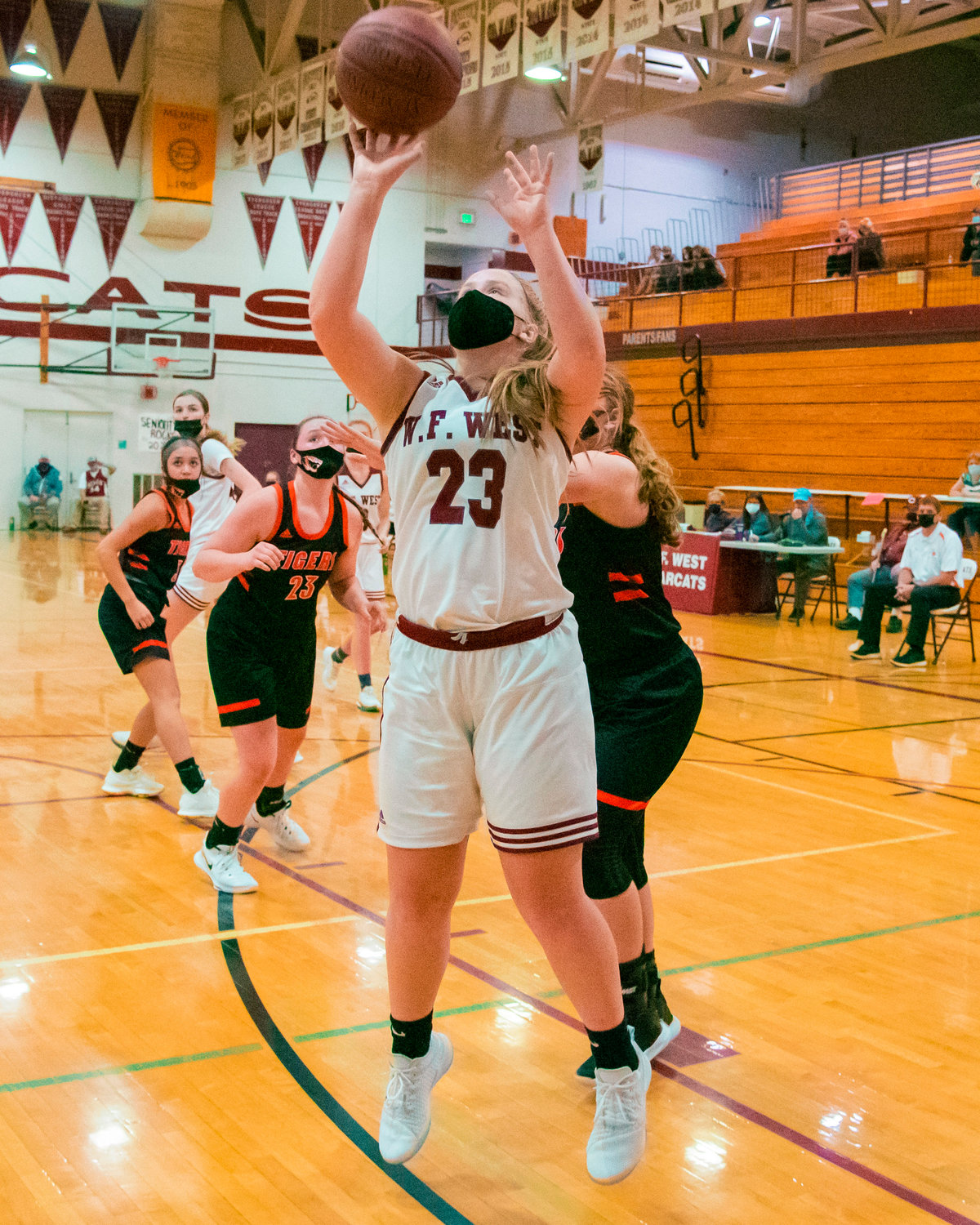 W.F. West’s Carlie Deskins (23) goes up with the ball during a game against the Tigers played Monday night in Chehalis.