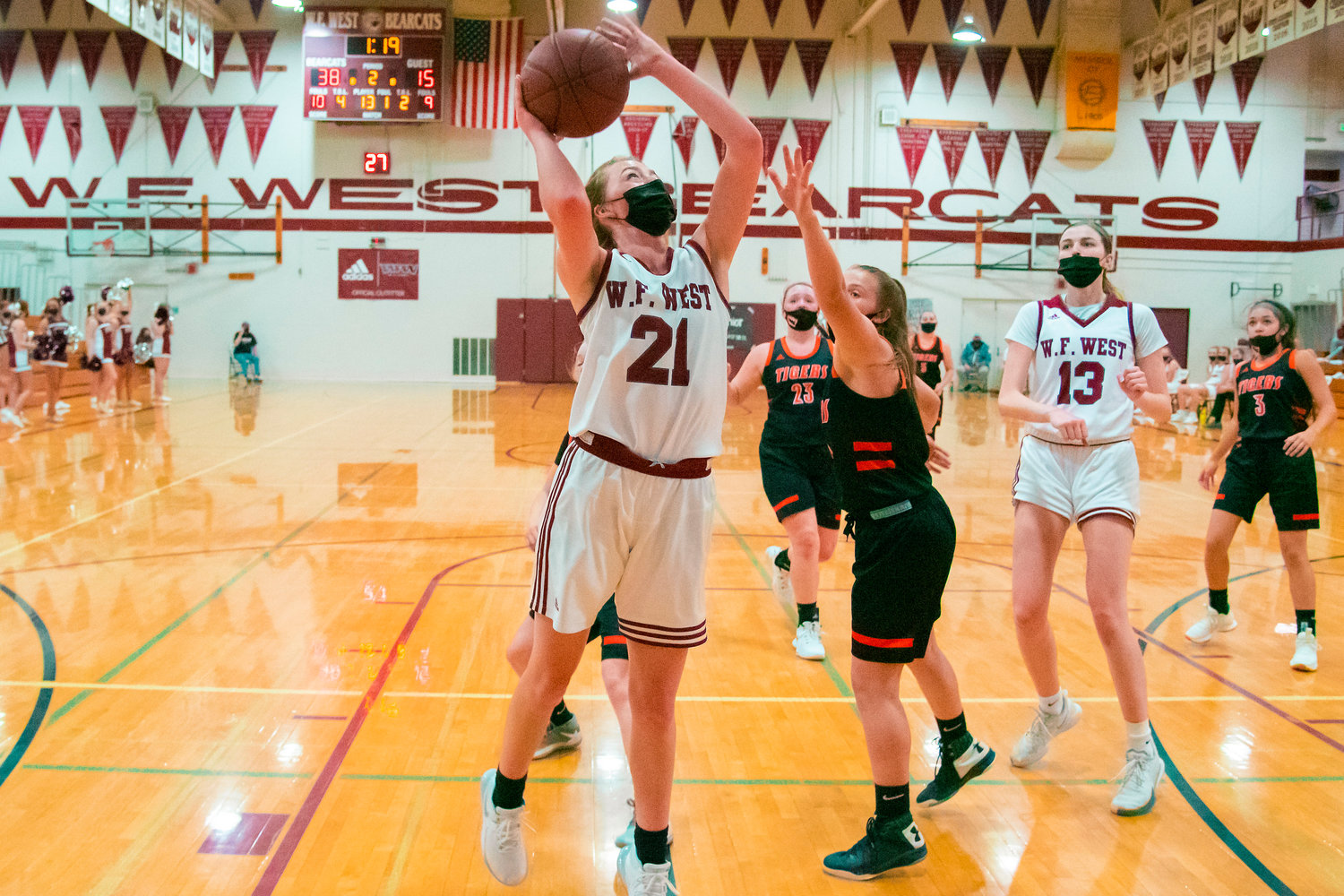 W.F. West’s Morgan Rogerson (21) goes up with the ball during a game against the Tigers played Monday night in Chehalis.