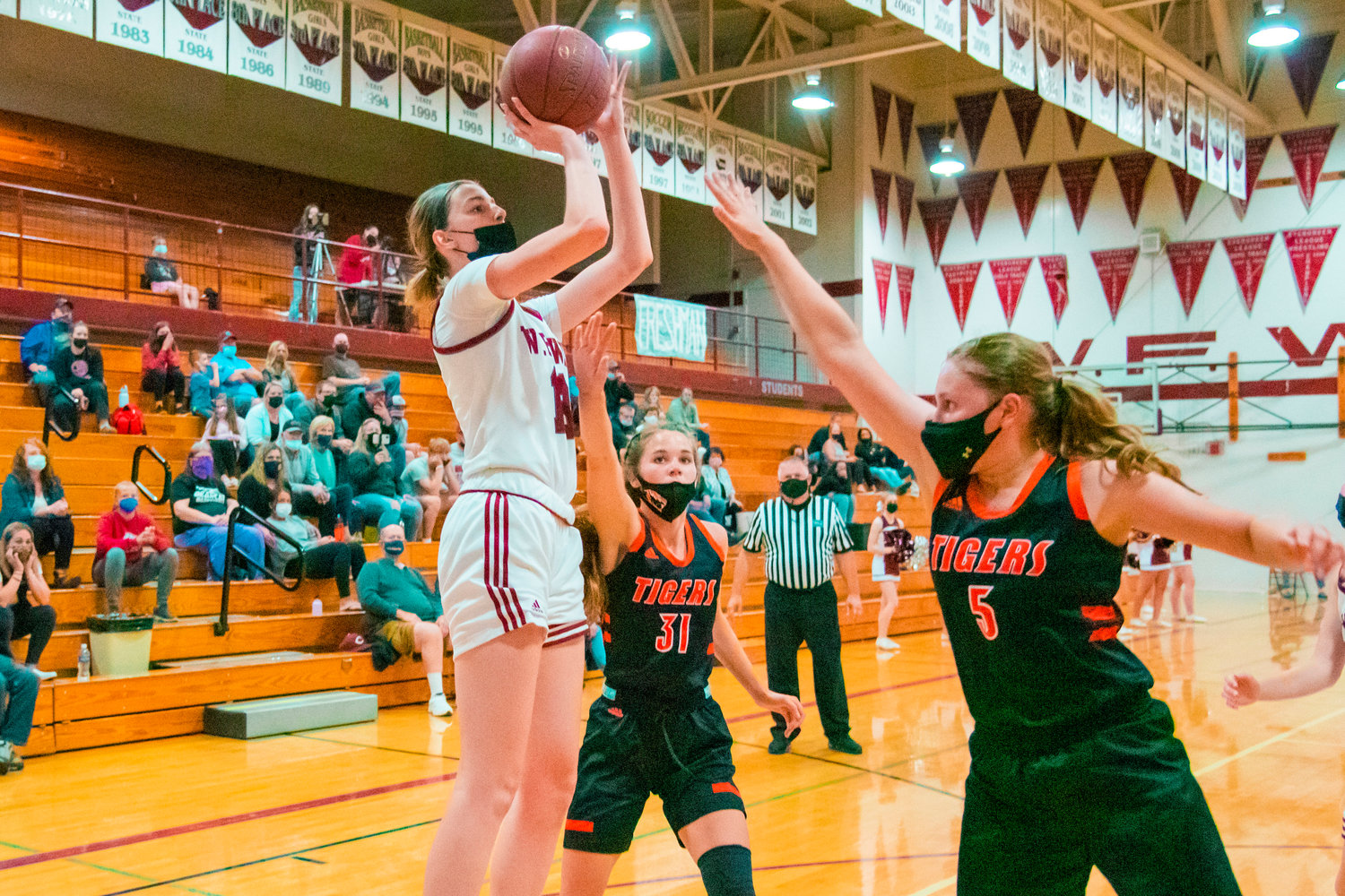 W.F. West’s Drea Brumfield (13) shoots over defenders during a game against the Tigers played Monday night in Chehalis.