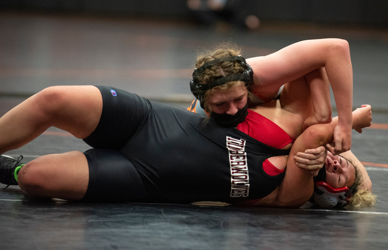 Centralia's Maya Kunkel, top, looks to pin a Black Hills opponent at a wrestling meet Tuesday in Centralia.