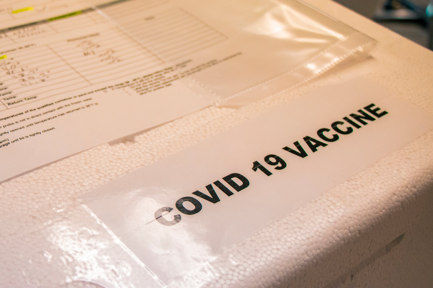 A cooler containing the Pfizer COVID-19 vaccine sits on a table at Prestige Post-Acute and Rehab Center last January.