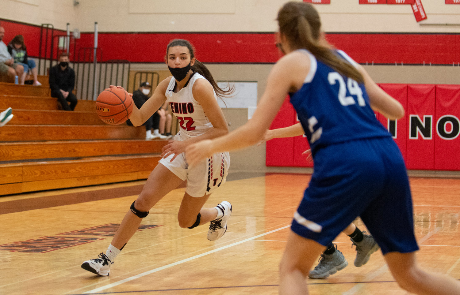 Tenino junior Ashley Schow (22) drives against Elma defenders at home on Saturday.
