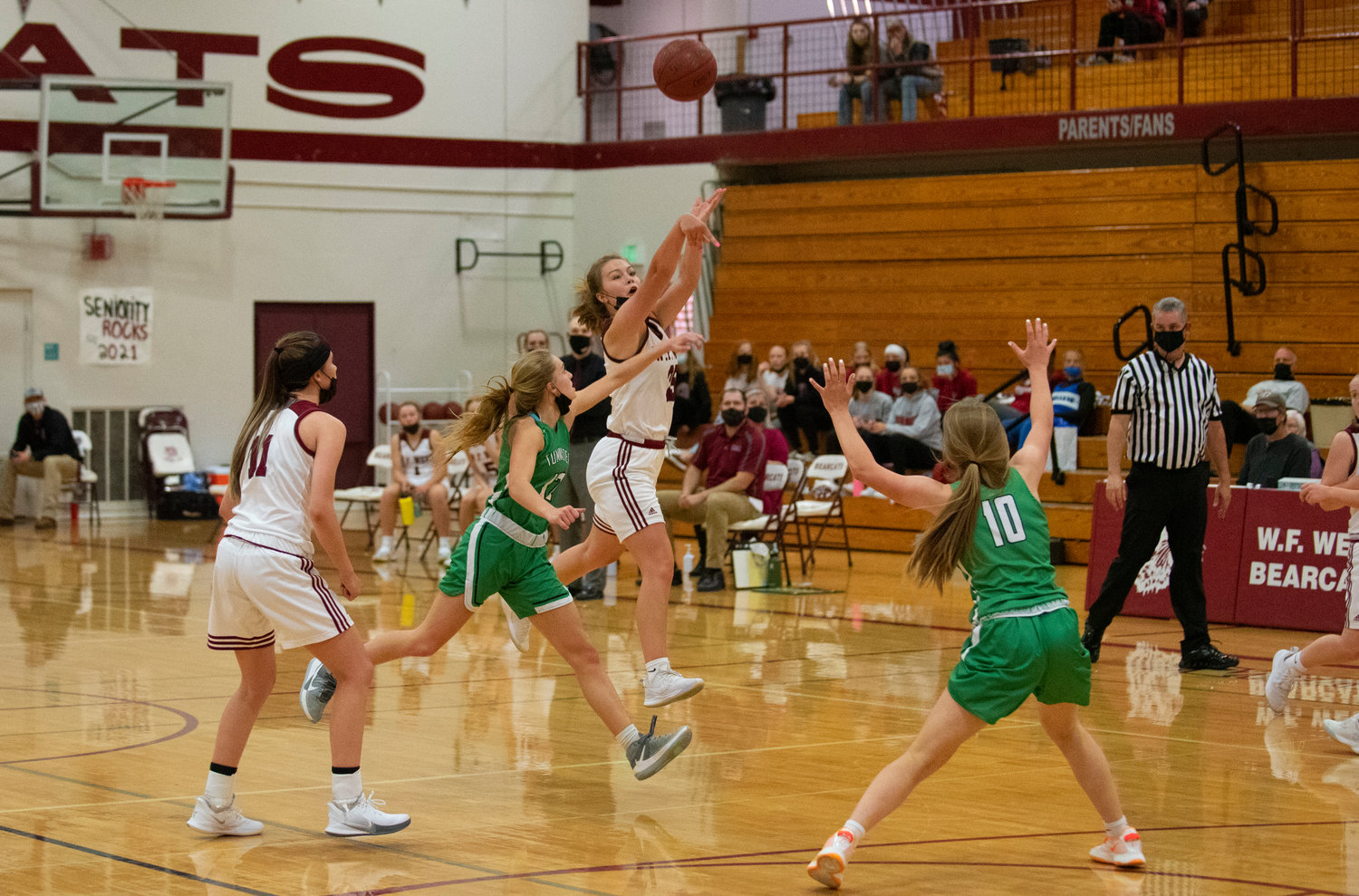 W.F. West's Kyla McCallum heaves a shot at the halftime buzzer against Tumwater on Monday.