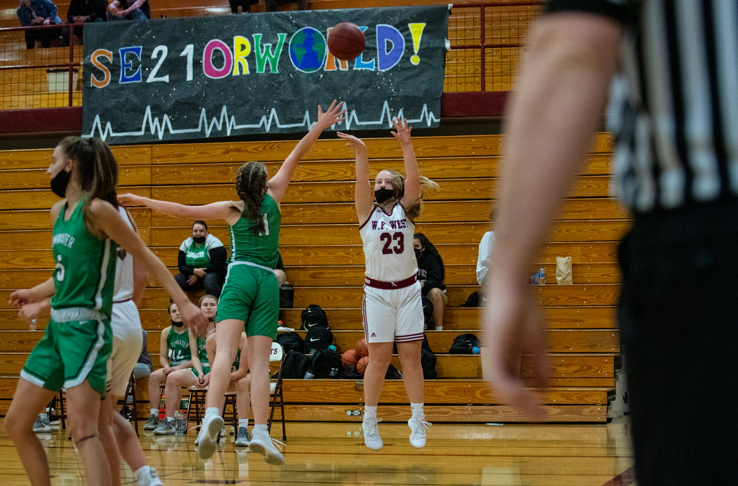 W.F. West's Carlie Deskins (23) shoots a 3-pointer over Tumwater's Aly Waltermeyer (11) on Monday.