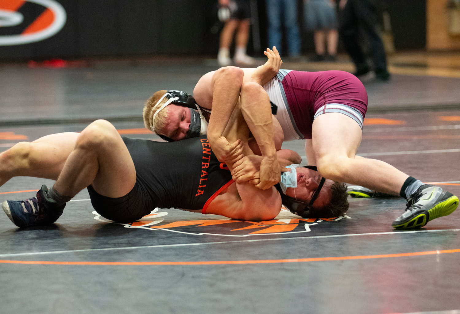 W.F. West senior Evan Moon, top, and Centralia senior Sawyer Kassel grapple in the 170-pound weight class on Tuesday. Moon would win the match by decision.