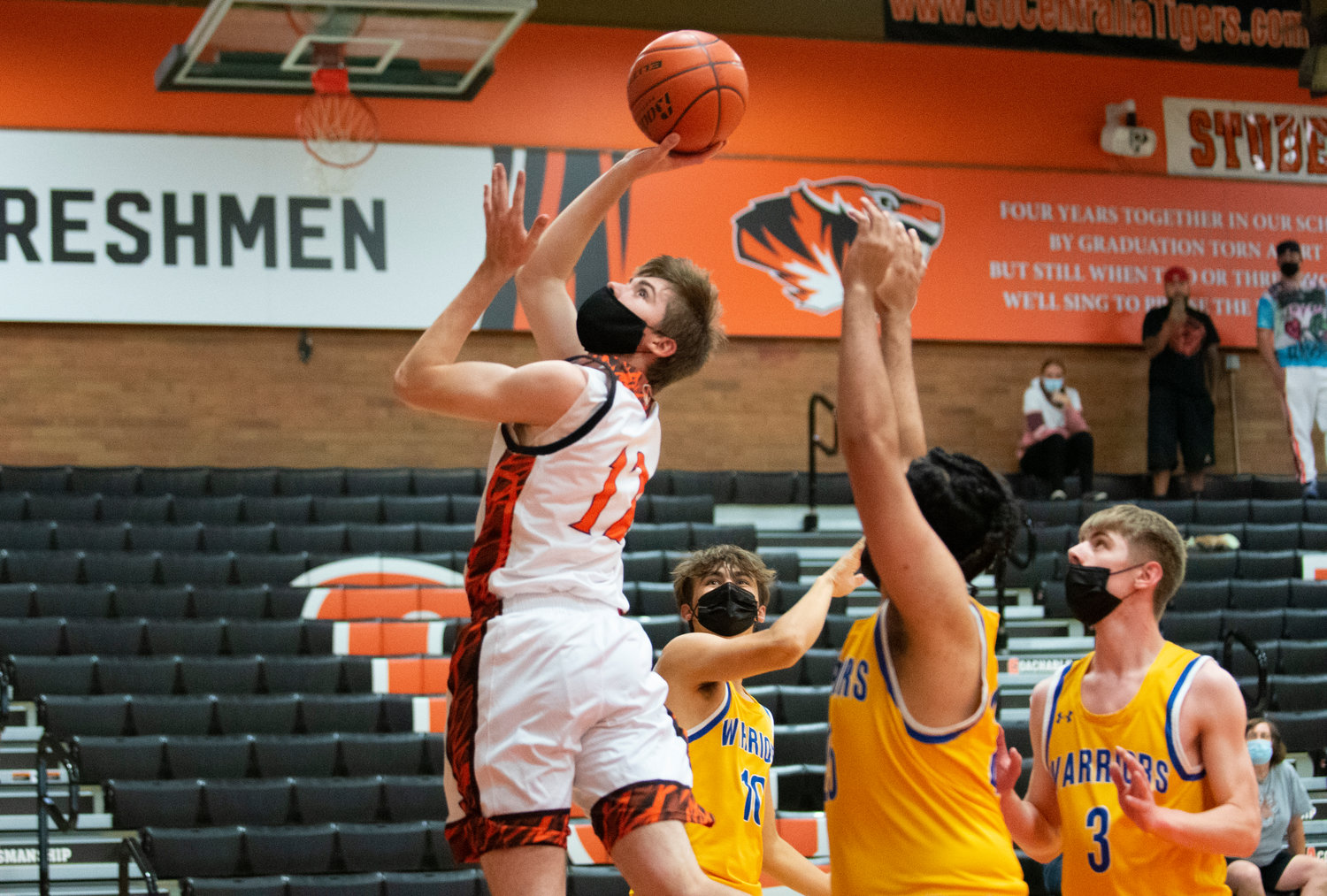 Centralia's Landon Kaut (12) twists for a layup against Rochester on Wednesday.