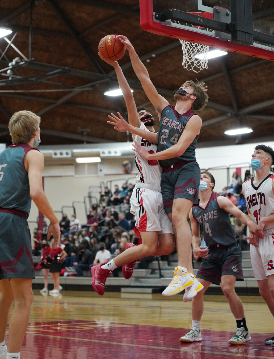 W.F. West senior Carter McCoy (24) blocks a Shelton shot during a road game on Wednesday.