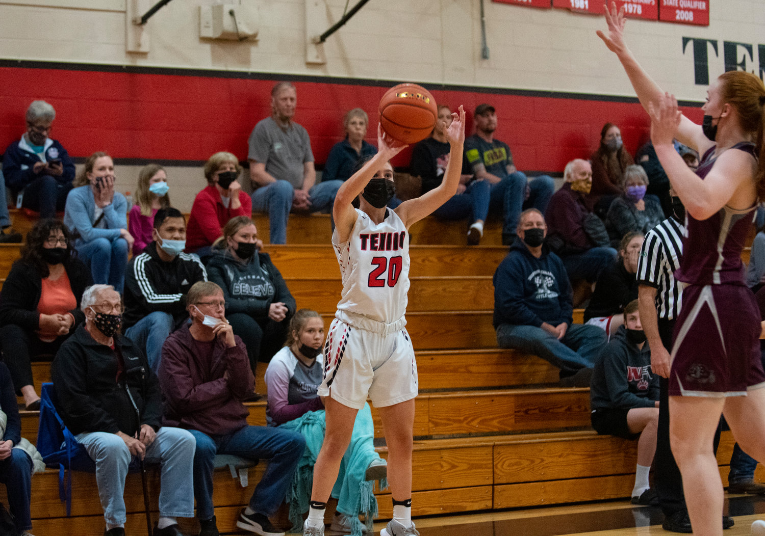 A Tenino player (20) shoots a 3-pointer against Montesano on Thursday.
