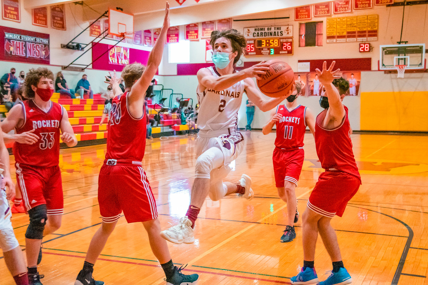 Winlock’s Landon Tiemens (2) goes up for a basket during a game against the Rockets on Thursday.