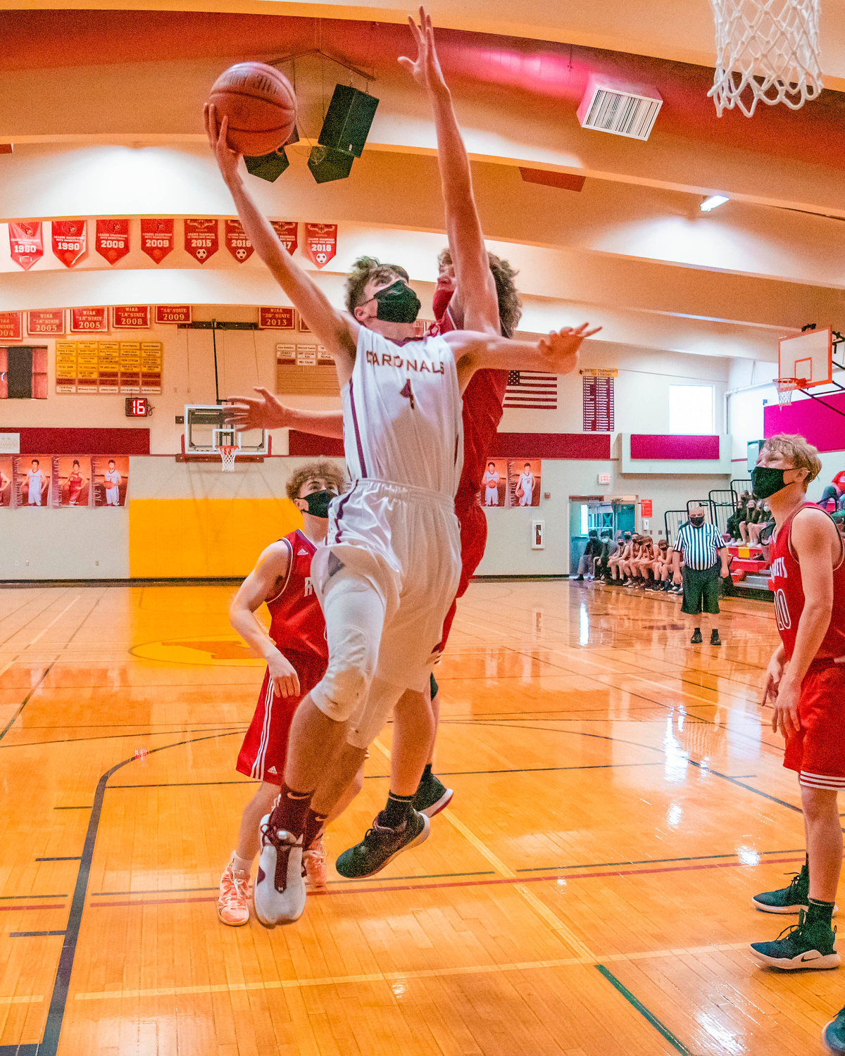 Winlock’s Payton SIckles (4) goes up with the ball during a game against the Rockets on Thursday.