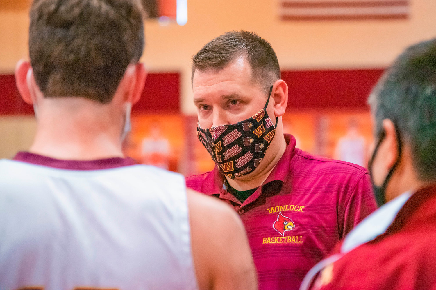 Winlock’s Head Coach Nick Bamer talks to players during a game against the Rockets on Thursday.