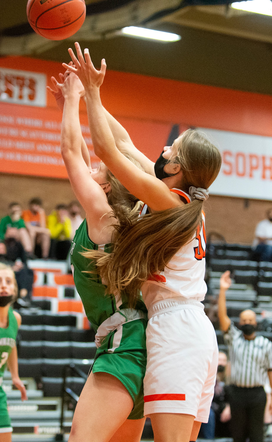 Centralia junior Maddie Corwin battles with a Tumwater player for a rebound on Friday.