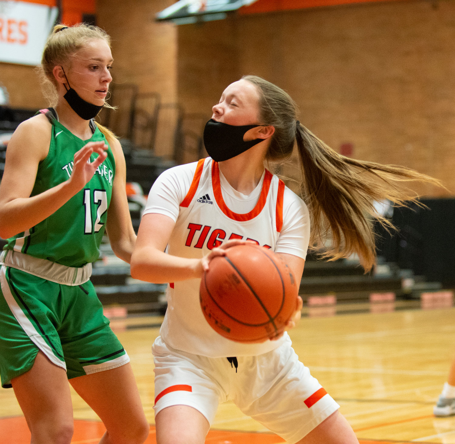 Centralia freshman Gracie Schofield looks for an open shot in the paint with Tumwater junior Aubrey Amendala (12) guarding.