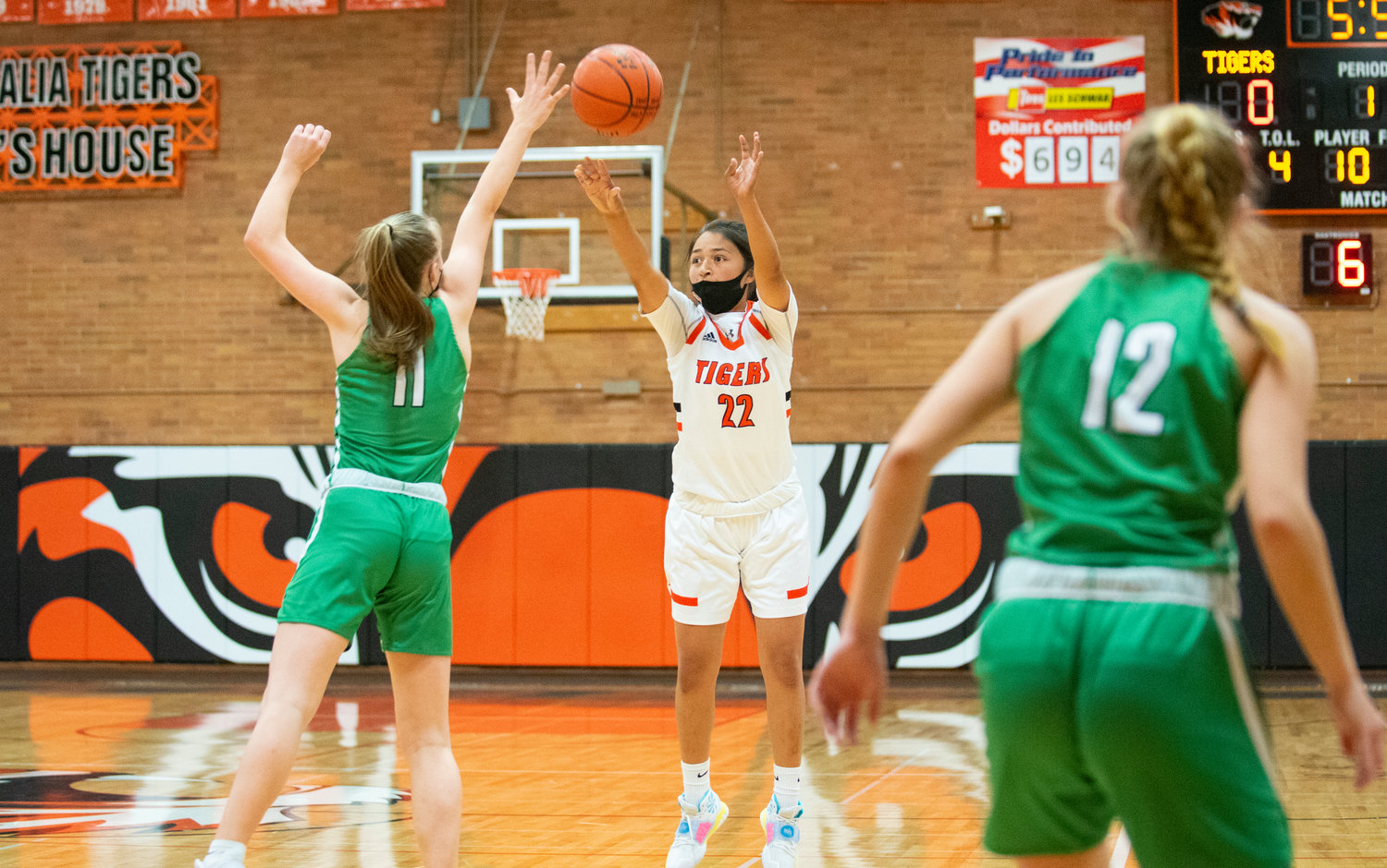 Centralia freshman Makayla Chavez (22) lets it rip from long range against Tumwater's Aly Waltermeyer (11) on Friday.