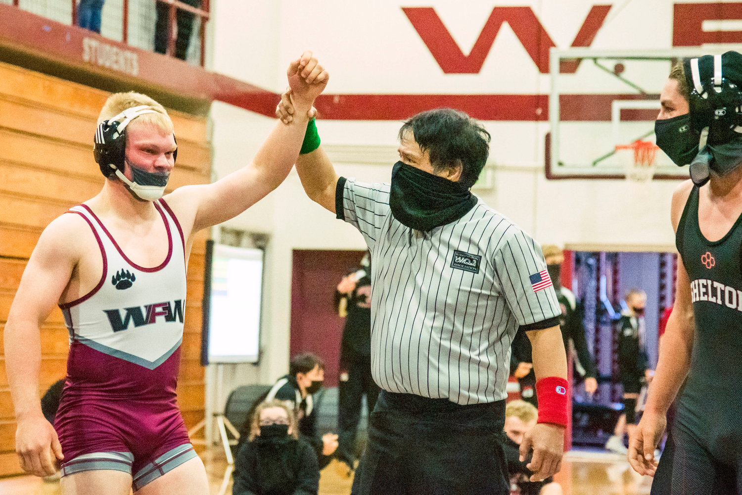 W.F. West’s Evan Moon has his arm raised after winning a match during Sub-Districts Saturday morning in Chehalis.