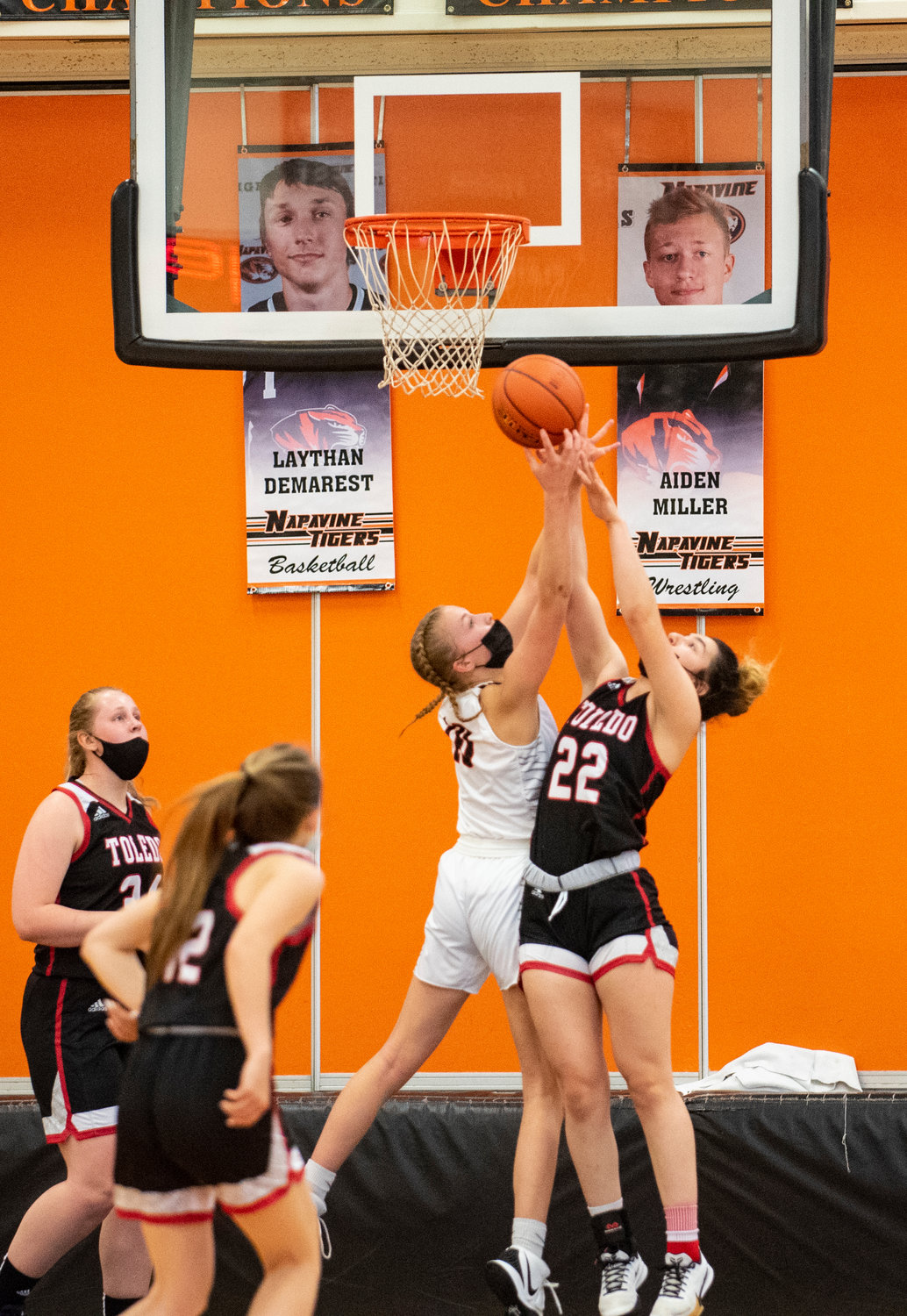 Napavine's Keira O'Neil (10) and Toledo's Abbie Marcil (22) battle for a rebound on Monday.