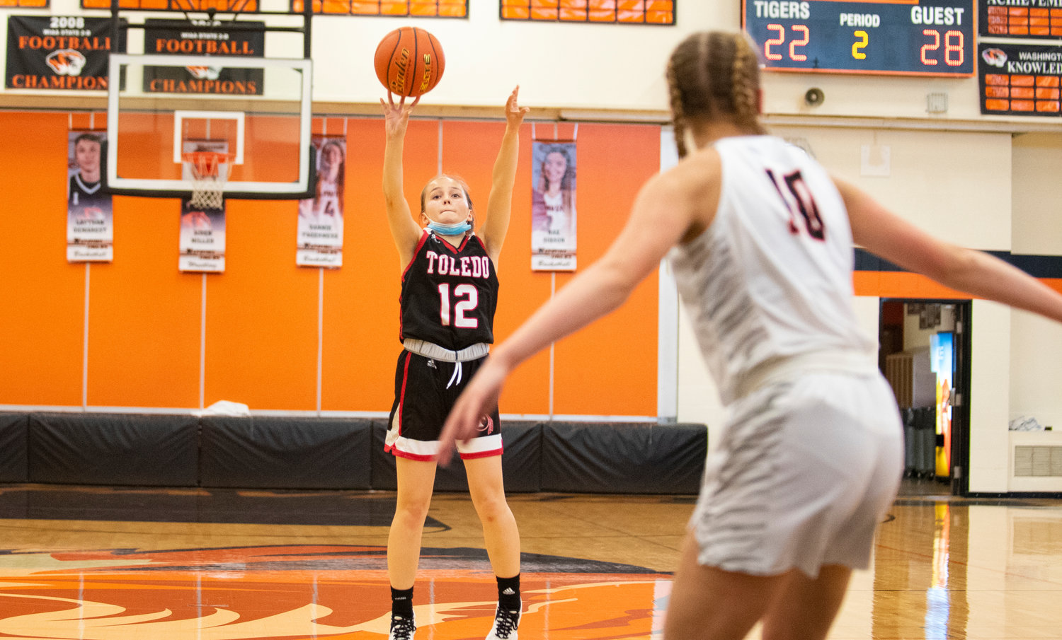 Toledo senior Gracie Madill (12) shoots a wide-open 3-pointer on the road at Napavine on Monday.