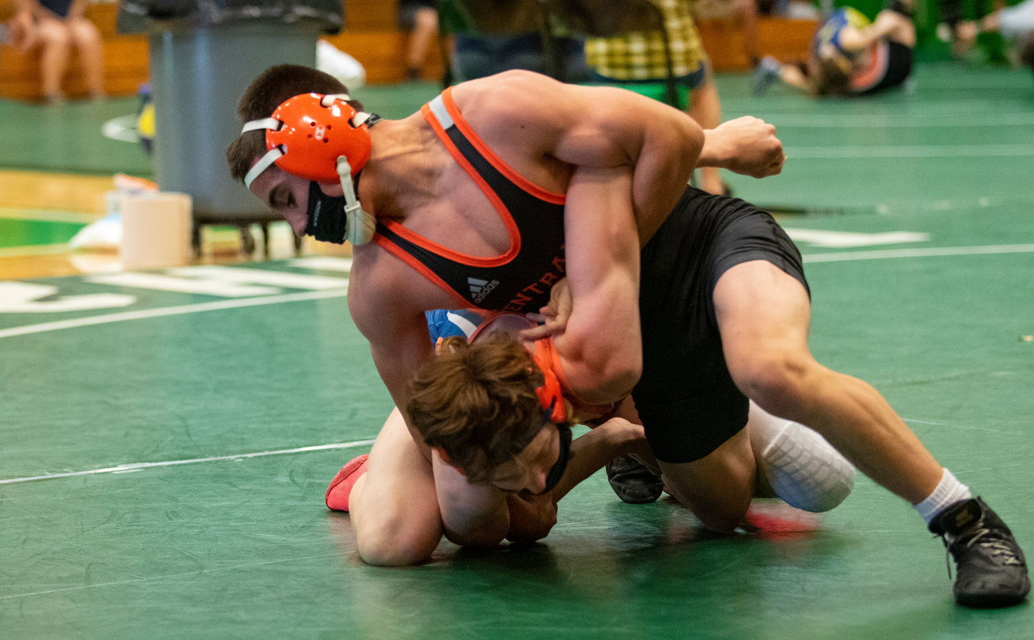 Centralia freshman prepares to for a first-round pin of a Ridgefield opponent in the opening round of the 120-pound bracket at the 2A District 4 Tournament Tuesday in Tumwater.