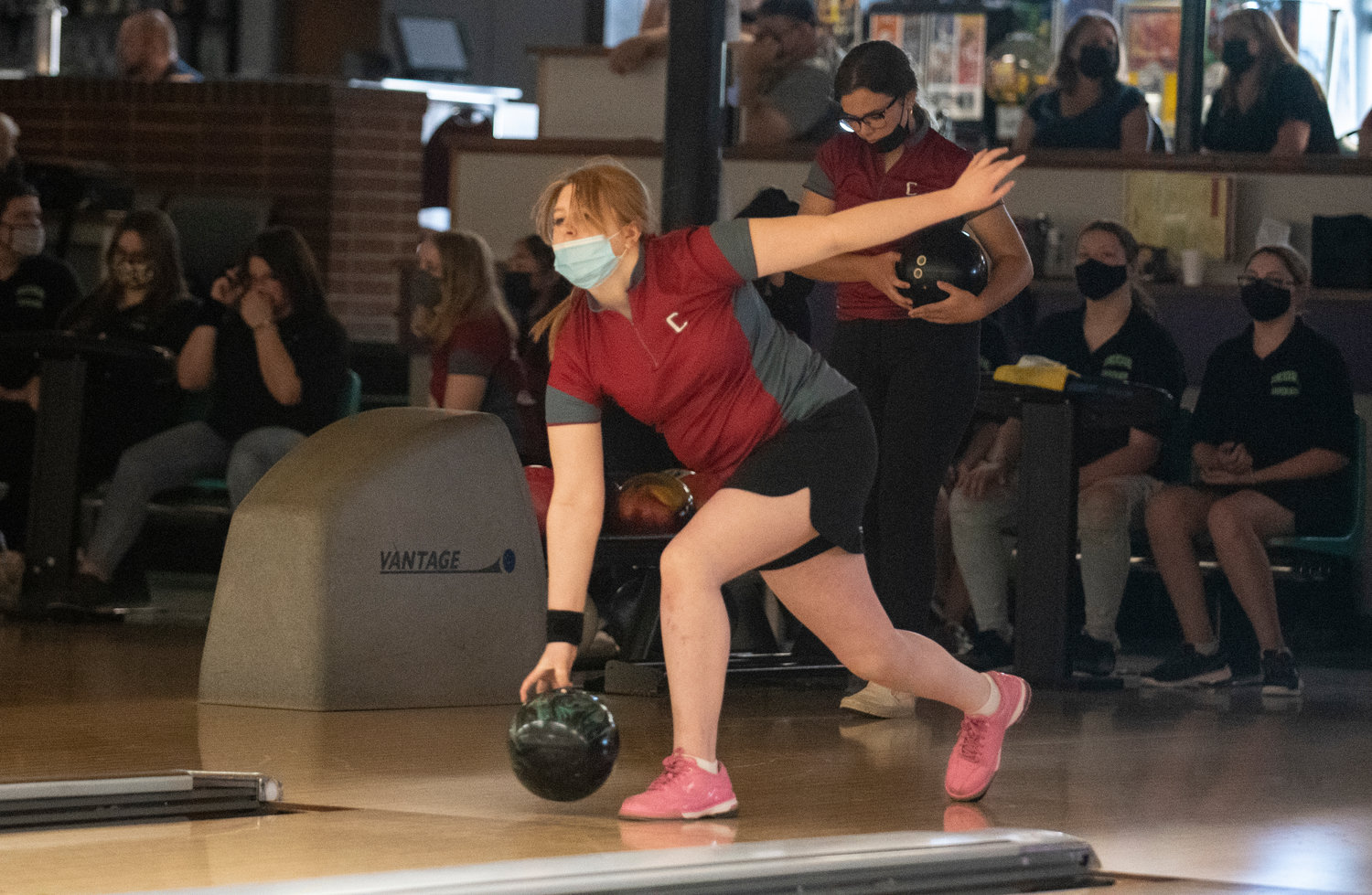 W.F. West sophomore Piper Chalmers tosses the ball during a match against Tumwater at Westside Lanes in Olympia on Monday.