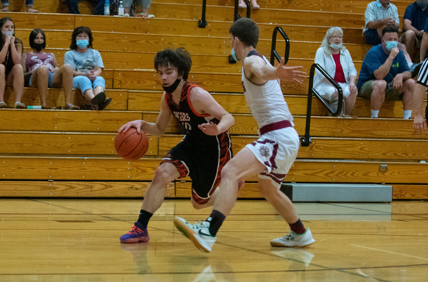 Centralia's Brandon Yeung drives against W.F. West's Cade Haller on Wednesday in Chehalis.
