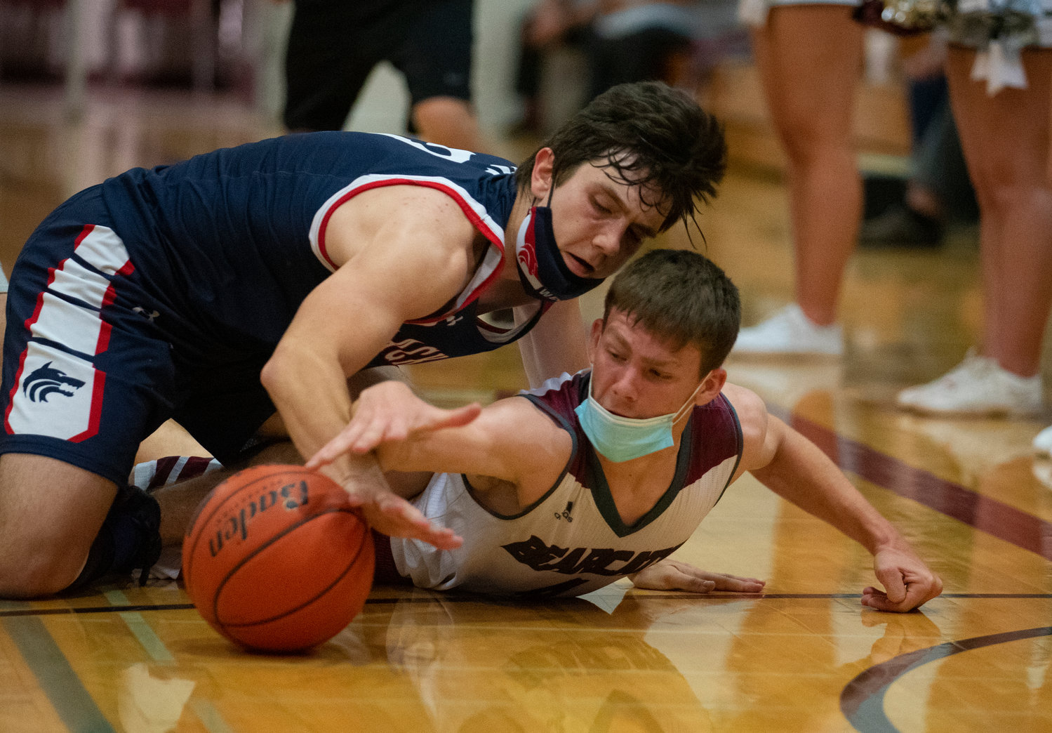 W.F. West senior Cade Haller battles with a Black Hills player for a loose ball on Friday.