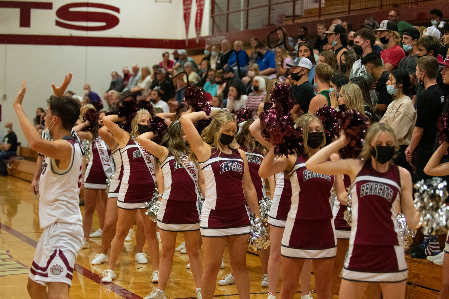 W.F. West cheerleaders cheer the Bearcats on in front of the student section on Friday.