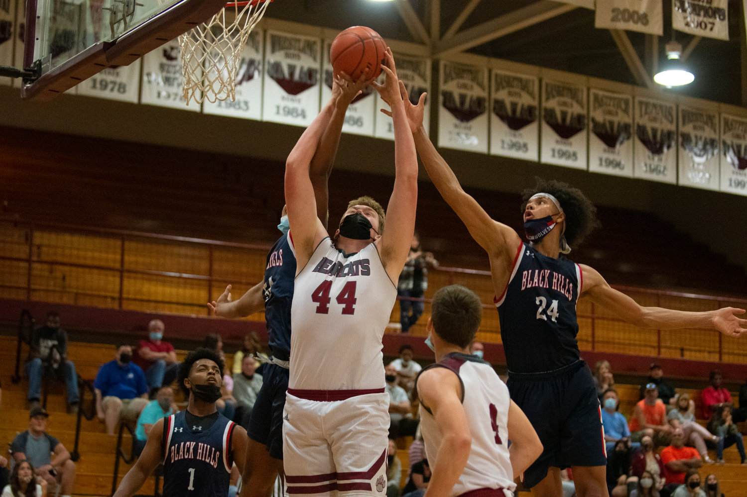 W.F. West sophomore Soren Dalan (44) grabs an offensive rebound against two Black Hills players on Friday.