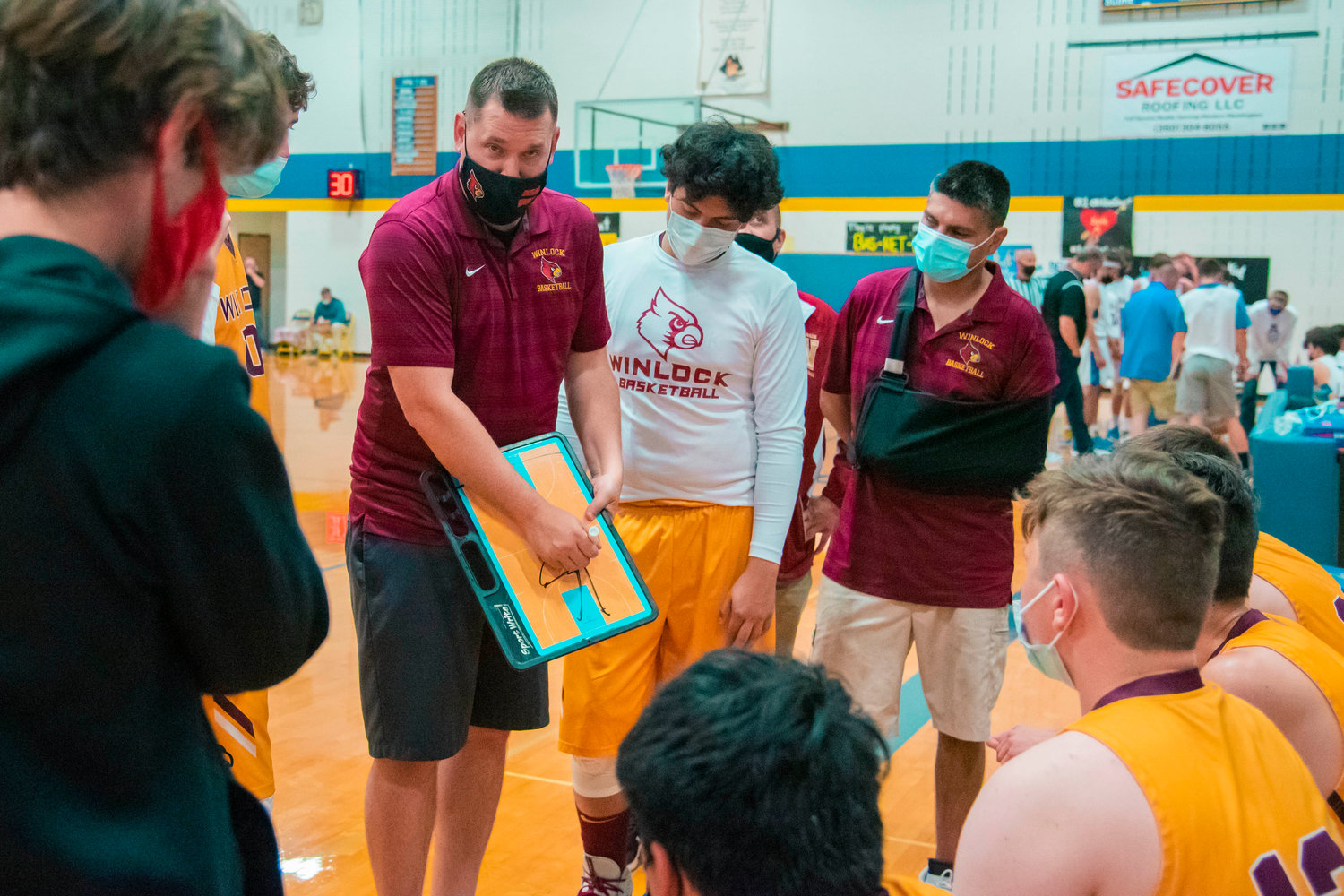 Winlock’s Head Coach Nick Bamer talks to players during a game on Friday in Adna.