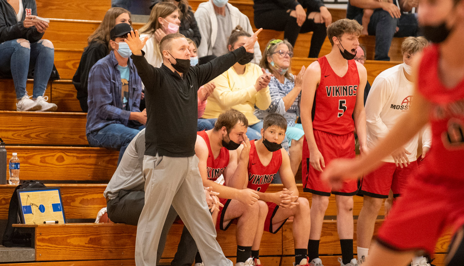 Mossyrock coach Adam Deck gives instructions to his team during the Vikings' district playoff game Monday.
