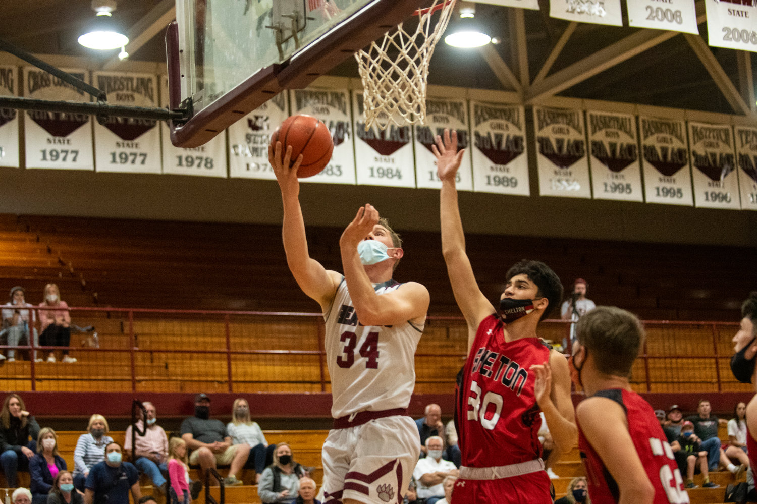 W.F. West senior Whalen Deskins (34) drives for a quick bucket against Shelton on Tuesday.