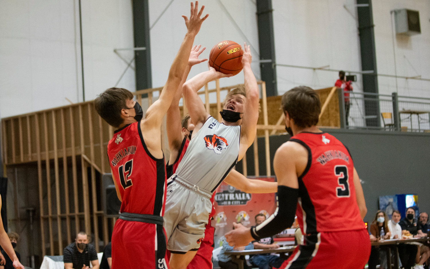 Napavine freshman Cael Stanley (2) shoots an off-balance jumper against Wahkiakum in the 2B District 4 semifinals Wednesday at the NW Sports Hub.