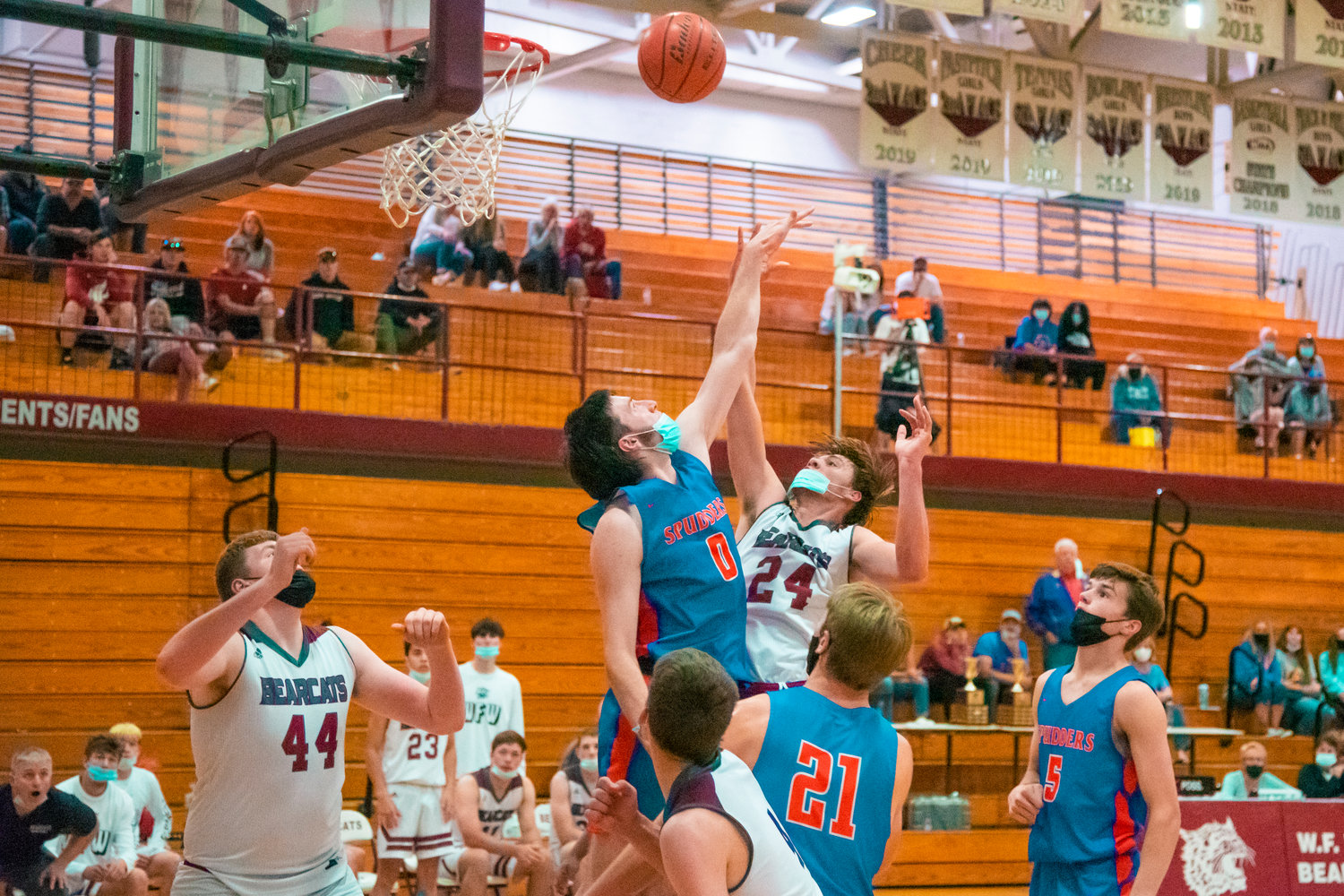 W.F. West's Carter McCoy (24) makes a shot over Ridgefield's Carson Knight (0) to put the Bearcats up in the final moments of the game Wednesday night.