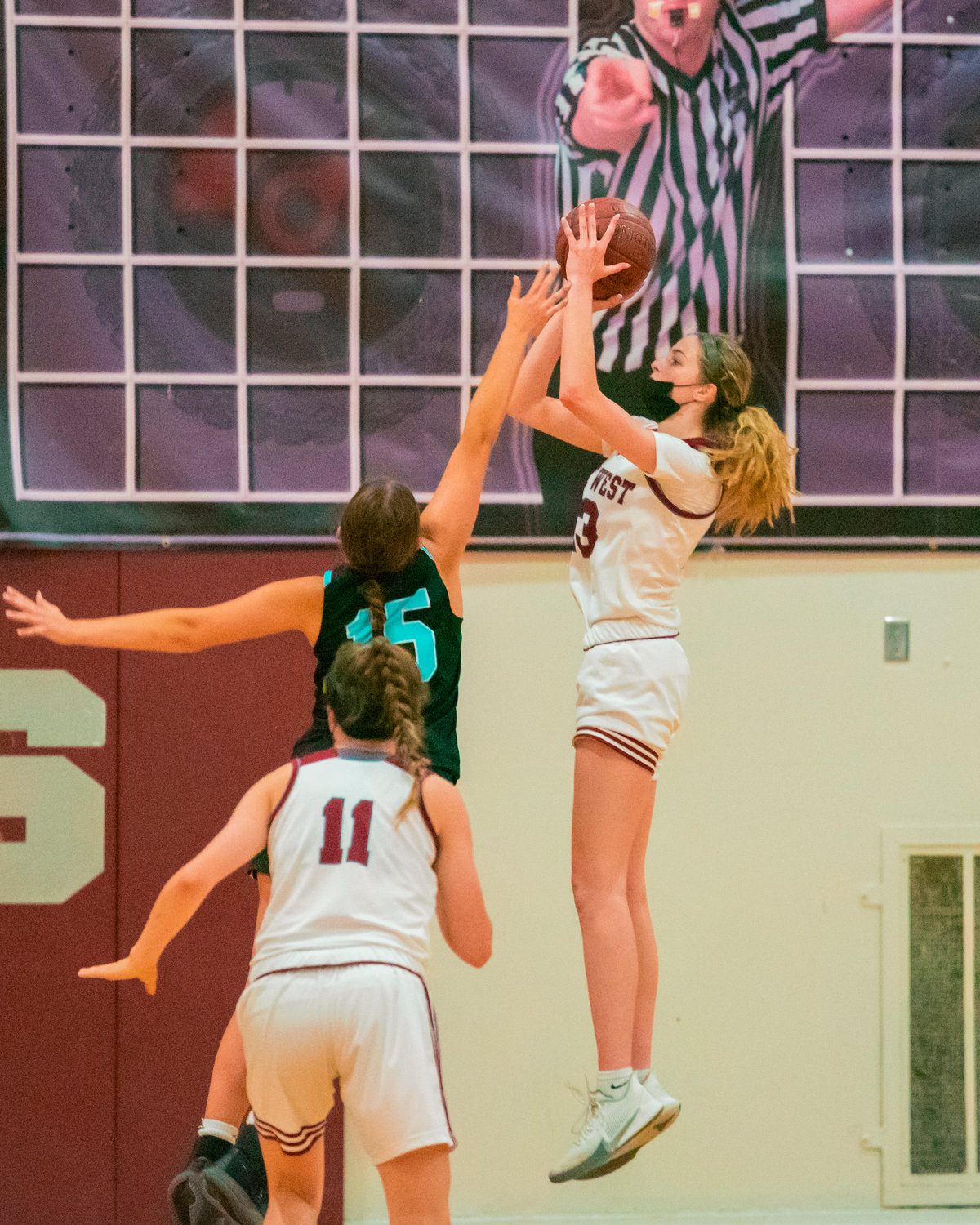 W.F. West's Drea Brumfield (13) goes up for a shot Wednesday night in Chehalis.