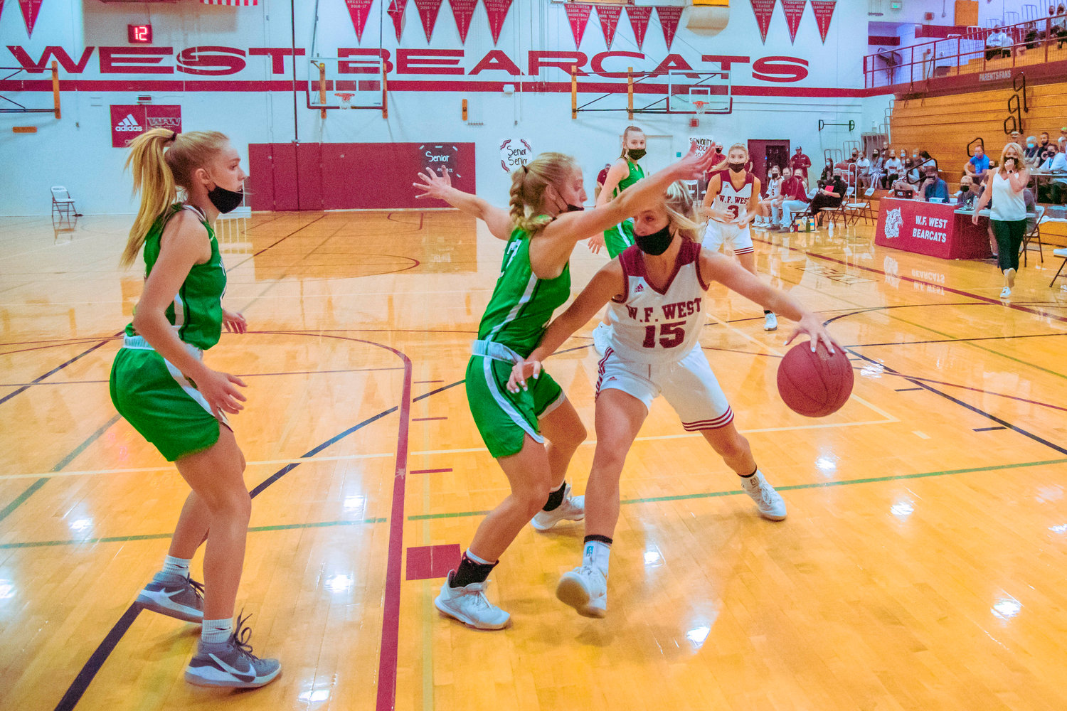 W.F. West’s Madi Mencke (15) dribbles in on Tumwater defenders during a game Thursday evening in Chehalis.
