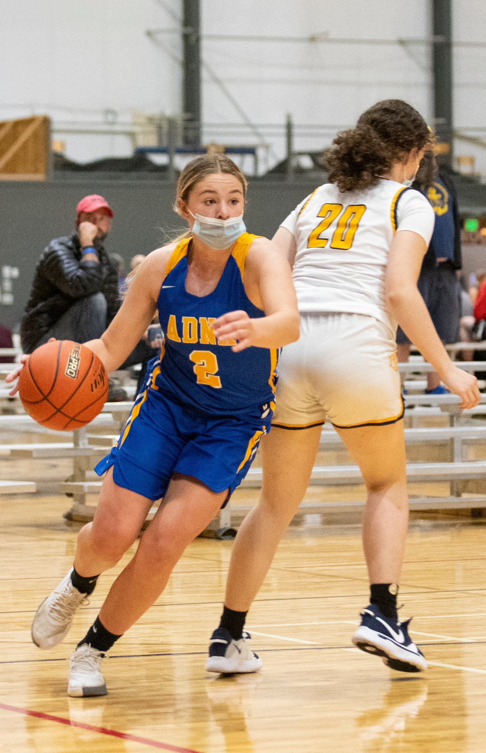 Adna's Summer White (2) drives around an Ilwaco defender on the baseline on Thursday.
