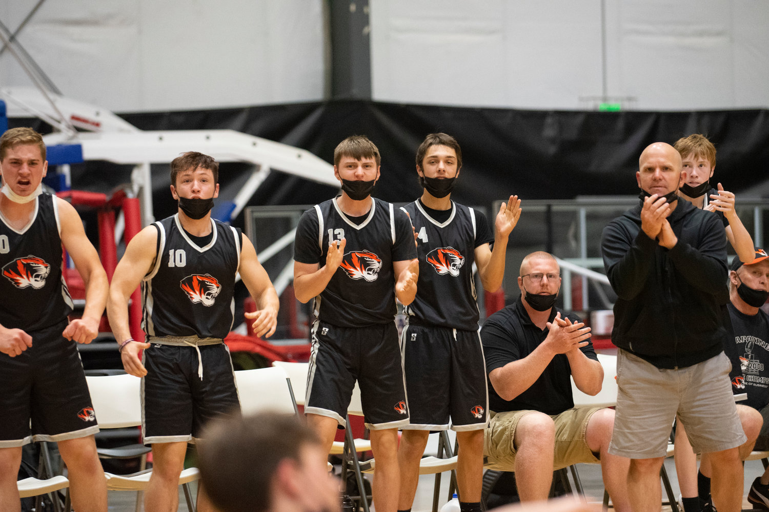 Napavine's bench reacts to a Tiger bucket against Kalama on Thursday.