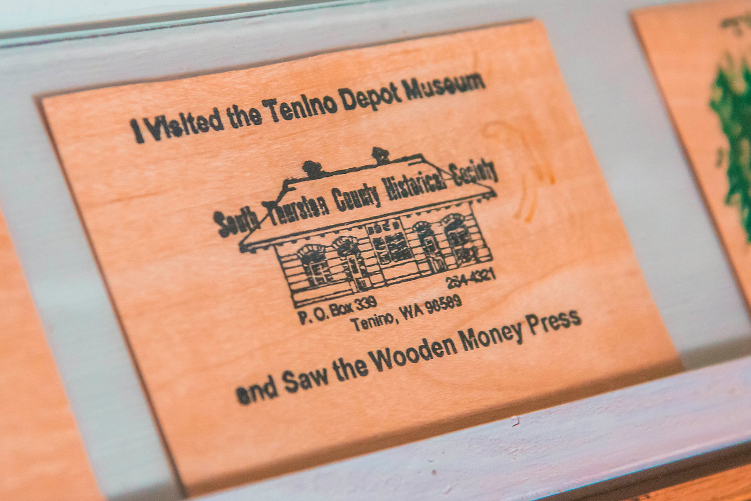 Wooden money is displayed inside the Tenino Depot Museum.