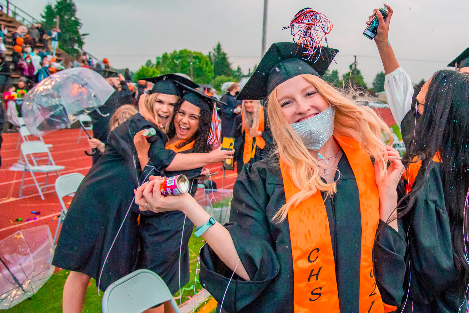 Centralia graduates celebrate with confetti, hugs, and Silly String after turning their tassels during a ceremony held Friday night at Tiger Stadium.