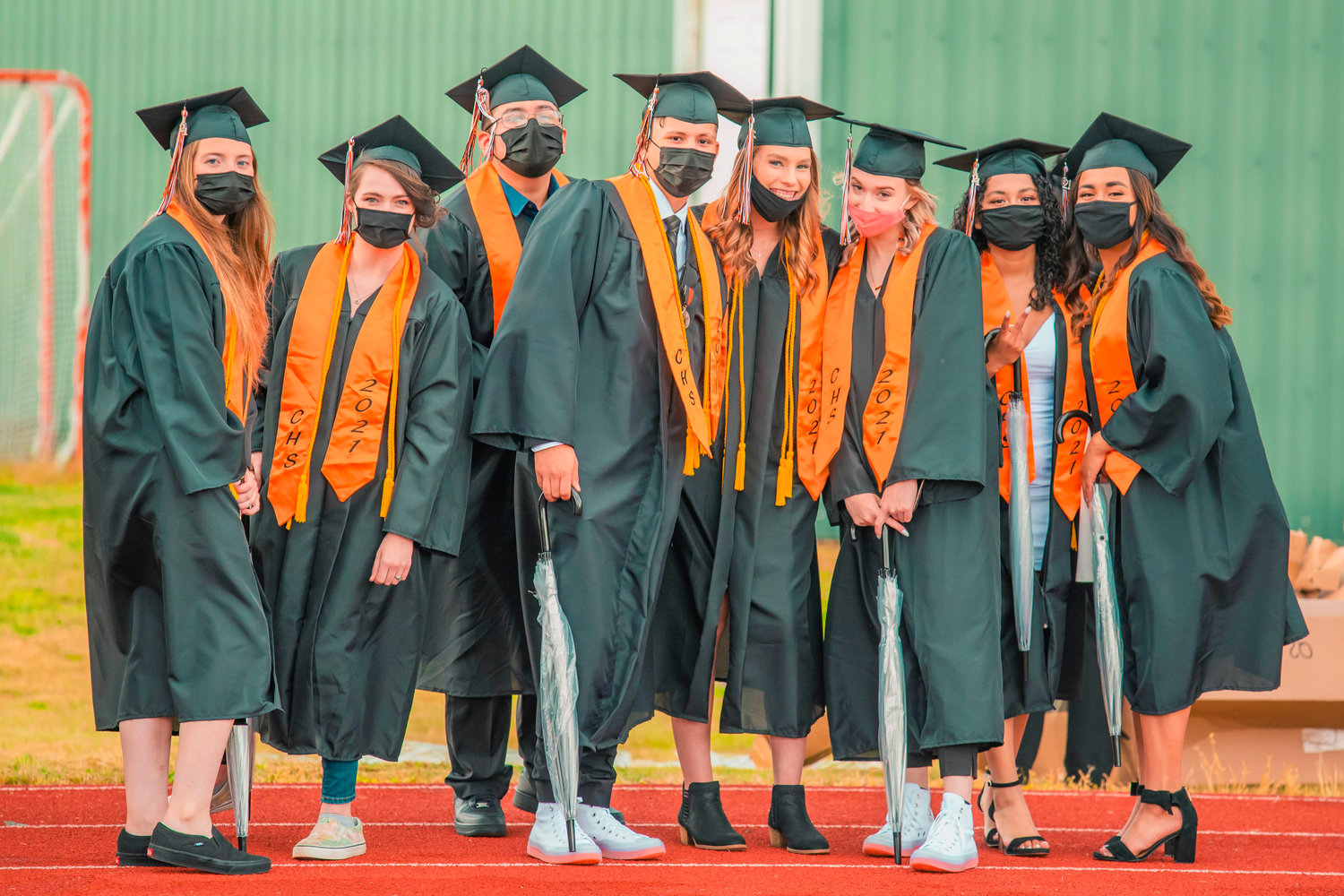 Centralia graduates sport masks and pose for a photo before receiving their diplomas Friday night at Tiger Stadium.